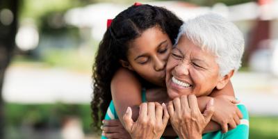 Granddaughter hugging grandmother