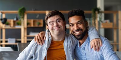 Young man with disability with carer